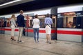 Group of young business people at subway station waiting for a train Royalty Free Stock Photo