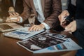 Group of young business people working and communicating while sitting at the office desk together with colleagues. Full Royalty Free Stock Photo