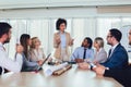 Group of young business people working together in creative office. Royalty Free Stock Photo