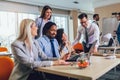 Young business people working together in creative office. Selective focus Royalty Free Stock Photo