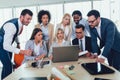 Young business people working together in creative office. Selective focus Royalty Free Stock Photo