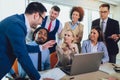 Young business people working together in creative office. Selective focus Royalty Free Stock Photo