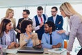 Young business people working together in creative office. Selective focus Royalty Free Stock Photo