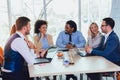 Group of young business people working together in creative office. Royalty Free Stock Photo