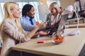 Young business people working together in creative office. Selective focus Royalty Free Stock Photo