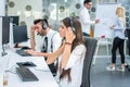 Group of young business people working together and giving support to customers in a call center office. Royalty Free Stock Photo