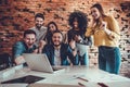 Group of young business team celebrating success at office Royalty Free Stock Photo