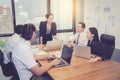 Group of young business team with woman manager standing leader meeting in conference room Royalty Free Stock Photo