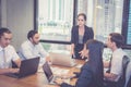 Group of young business team with woman manager standing leader meeting in conference room Royalty Free Stock Photo