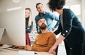 Group of young businesspeople with laptop having meeting in a modern office. Royalty Free Stock Photo