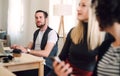 Group of young businesspeople with laptop working in a modern office. Royalty Free Stock Photo