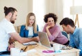 Group of young businesspeople with laptop working in a modern office. Royalty Free Stock Photo