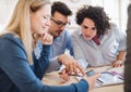 A group of young businesspeople with laptop working together in a modern office. Royalty Free Stock Photo