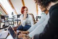 Group of young businesspeople using laptop in office, start-up concept. Royalty Free Stock Photo