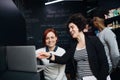 Group of young businesspeople using laptop in office, start-up concept. Royalty Free Stock Photo