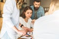 Group of young businesspeople work together. Brainstorming, teamwork, startup, business planning. Hipsters learning Royalty Free Stock Photo