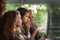 Group of young businesspersons looking intently at the screen Royalty Free Stock Photo