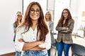 Group of young businesswoman smiling happy standing with arms crossed gesture at the office Royalty Free Stock Photo