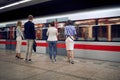 Group of young caucasian business people at subway station waiting for a train Royalty Free Stock Photo