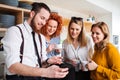 A group of young business people on coffee break in office kitchen, taking selfie. Royalty Free Stock Photo