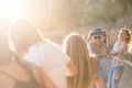 Group of young cheerful happy woman play with a cord all together for sumer leisure activity outdoor - playful and happiness Royalty Free Stock Photo