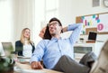 Group of young cheerful businesspeople working together in a modern office. Royalty Free Stock Photo