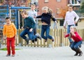 Group of young children in high spirits jumping