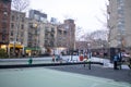 Group of young children play a competitive game of basketball outdoors in New York, United States