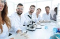 Group of young clinicians experimentation in research laboratory Royalty Free Stock Photo