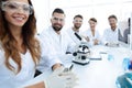 Group of young clinicians experimentation in research laboratory Royalty Free Stock Photo