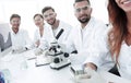 Group of young clinicians experimentation in research laboratory Royalty Free Stock Photo