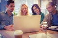Group of young colleagues using laptop Royalty Free Stock Photo