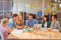 Group of young colleagues using laptop