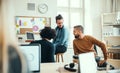 Group of young businesspeople with laptop working together in a modern office. Royalty Free Stock Photo