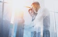 Group of young coworkers on business meeting.Business team in working process.Double exposure,skyscraper building Royalty Free Stock Photo