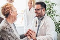 Young doctor during home visit senior people Royalty Free Stock Photo