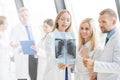 Group of doctors discuss x-ray Royalty Free Stock Photo