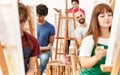 Group of young draw students smiling happy drawing at art studio