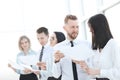 Group of young employees discussing something in the office hallway. Royalty Free Stock Photo