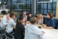 Group of young energetic diversity classmate students brainstorming together with professor in workshop for class final project Royalty Free Stock Photo