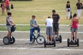 Group of young European their bicycles and segways