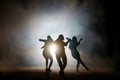 Group of young female dancers on the street at night