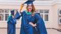 A group of young female graduates. Female graduate is smiling against the background of university graduates Royalty Free Stock Photo