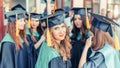 A group of young female graduates. Female graduate is smiling against the background of university graduates Royalty Free Stock Photo