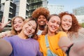 Group of young feminine women taking a selfie portrait, smiling looking at camera. Teenage girls laughing and posing for Royalty Free Stock Photo
