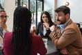 Group of young freelancers real estate agents have business meeting in cafeteria discussing about prices and situation on the rent Royalty Free Stock Photo