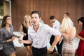 Group of young friends dancing Royalty Free Stock Photo