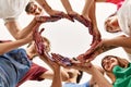 Group of young friends doing circle symbol with hands together Royalty Free Stock Photo