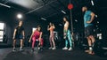 Group of young friends doing sports, training at gym indoors, building muscles and srength Royalty Free Stock Photo