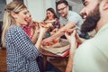 Group of young friends eating pizza. Royalty Free Stock Photo